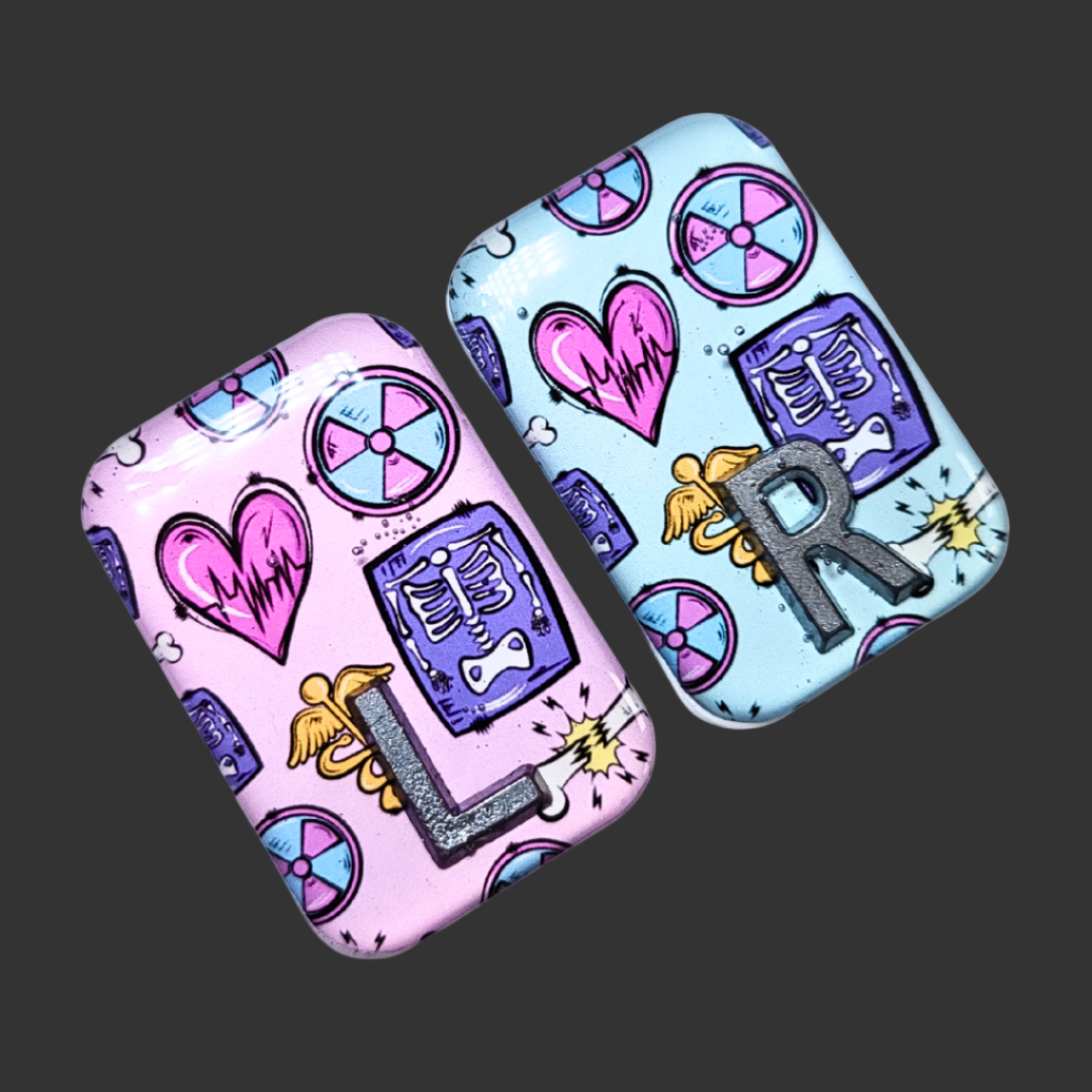 X RAY MARKERS THAT ARE PINK AND TEAL WITH X RAY SYMBOLS ON, RADIOGRAPHER AND X RAY TECH MARKERS