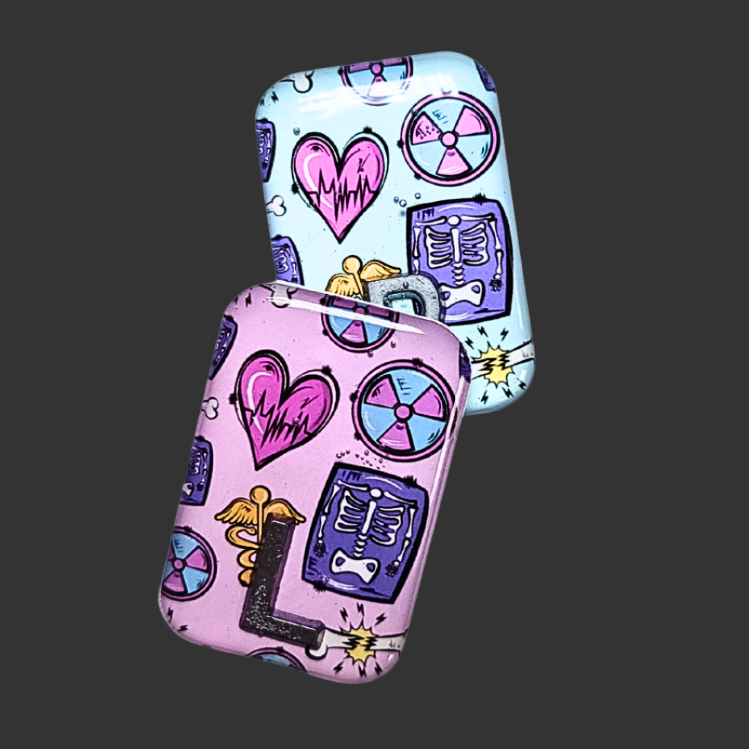 X RAY MARKERS THAT ARE PINK AND TEAL WITH X RAY SYMBOLS ON, RADIOGRAPHER AND X RAY TECH MARKERS