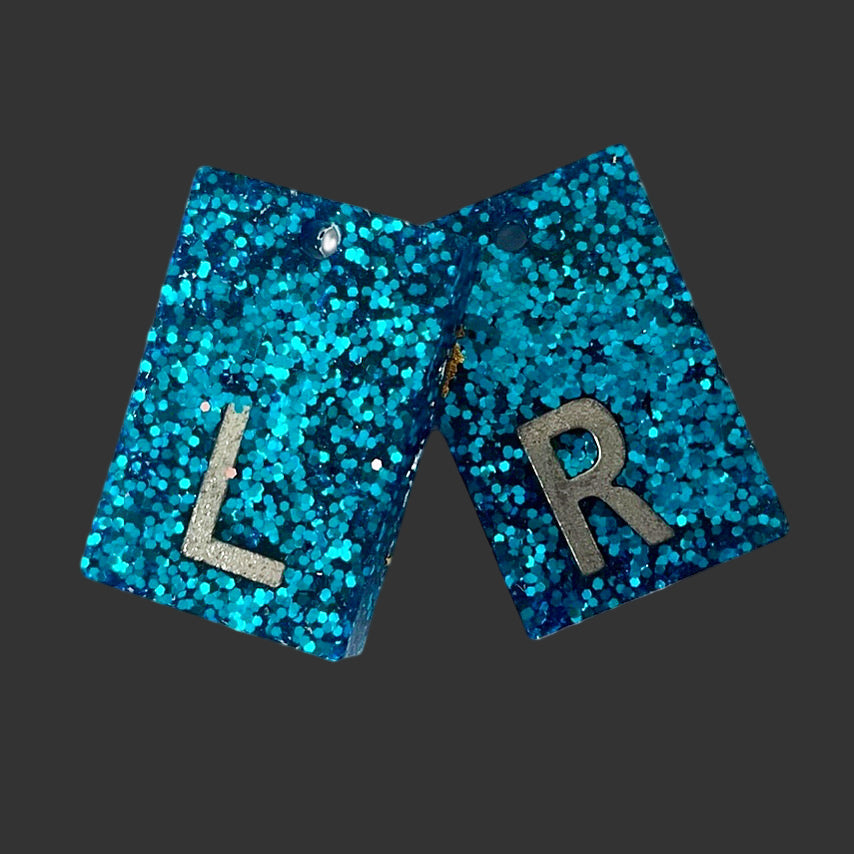 blue glitter acrylic X-ray markers with chain hole, personalised for radiographers