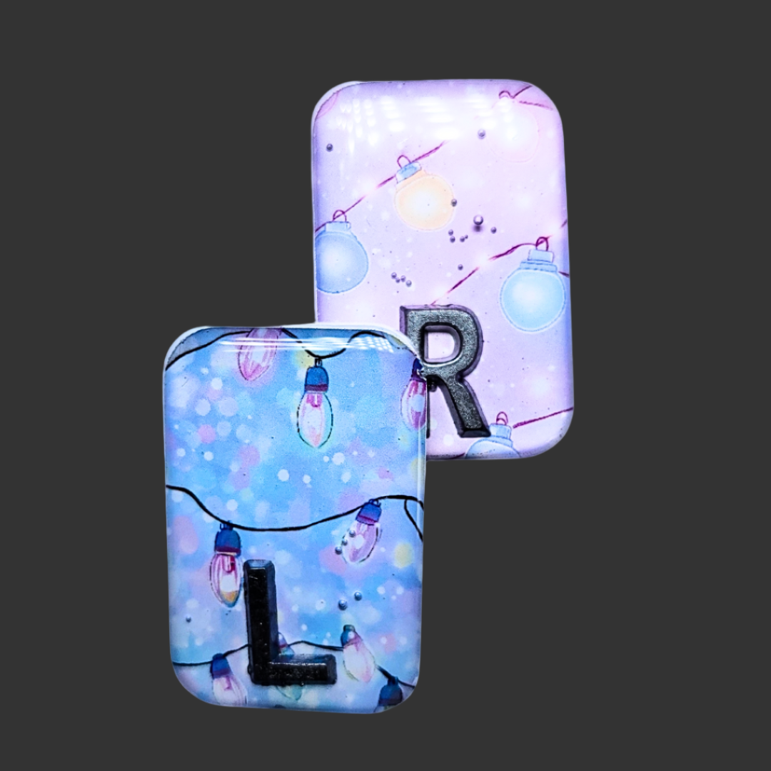 "Blue and pink fairy light X-ray markers customized with initials or numbers.