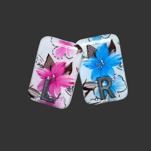 x ray markers featuring a pink and blue flower design these are handmade by x ray vision uk for radioraphers and x ray techs
