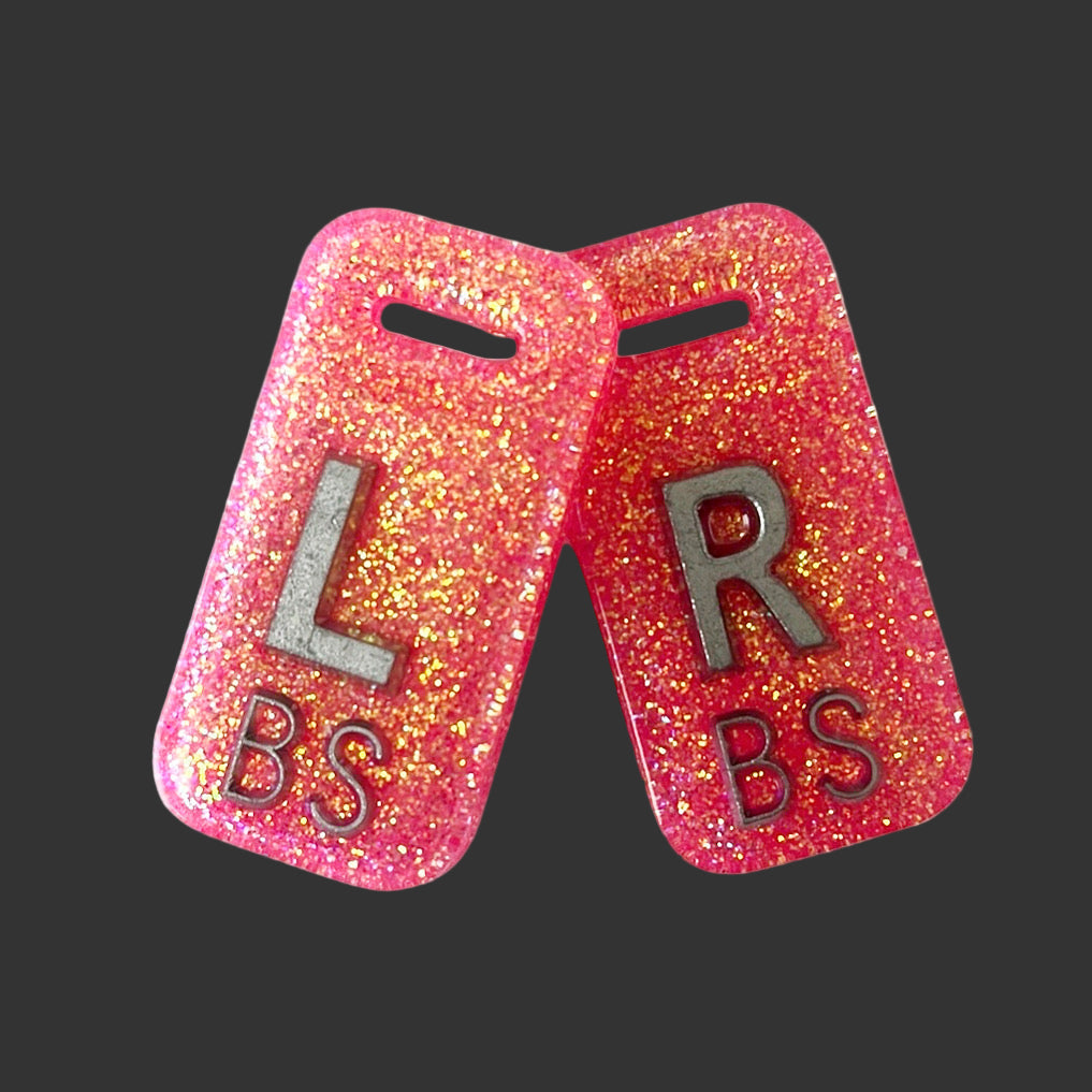 Neon pink glitter acrylic X-ray marker set with chain hole, personalised for radiographers and x ray techs
