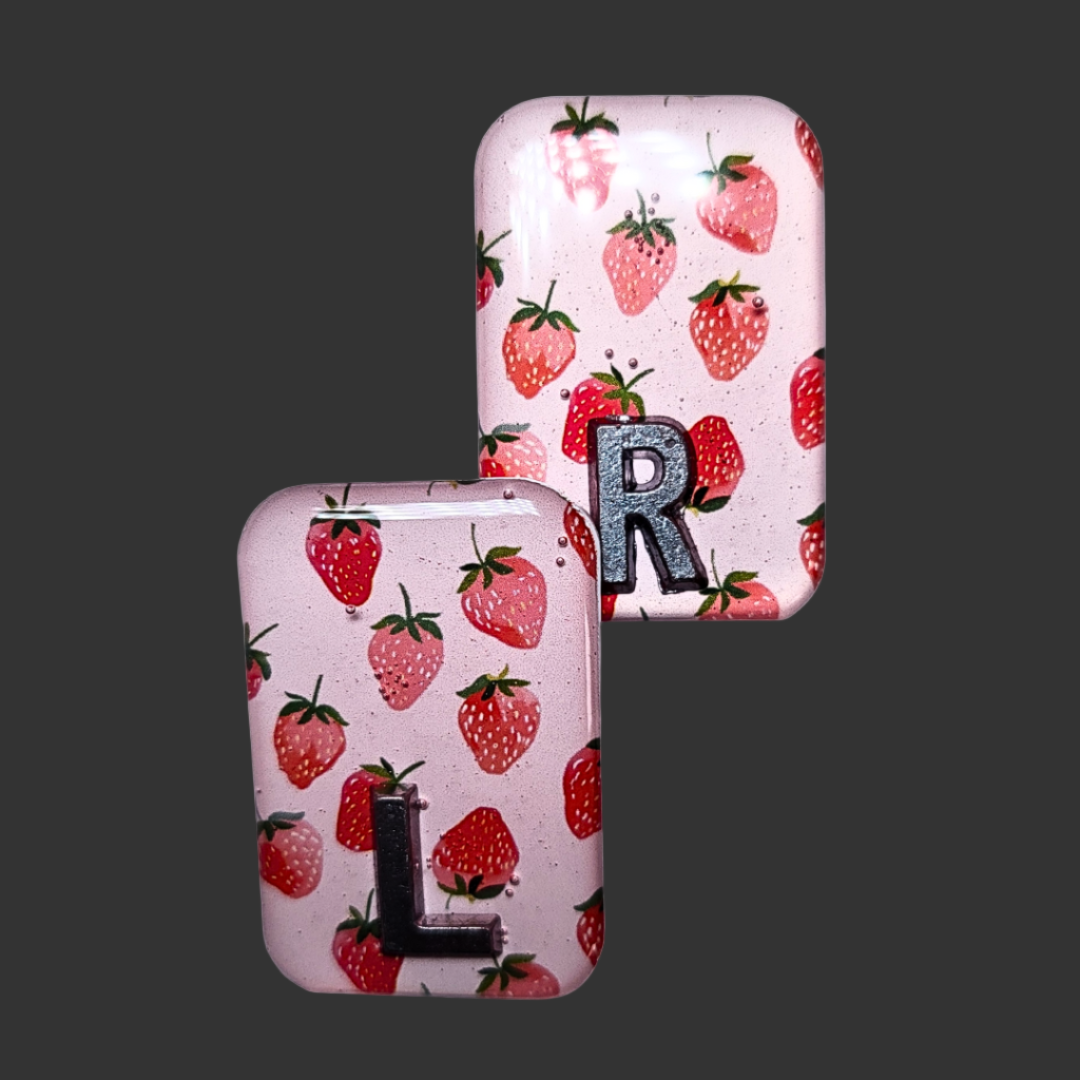 Strawberry-themed X-ray markers in red and green, fun and functional for radiographers and X-ray techs.