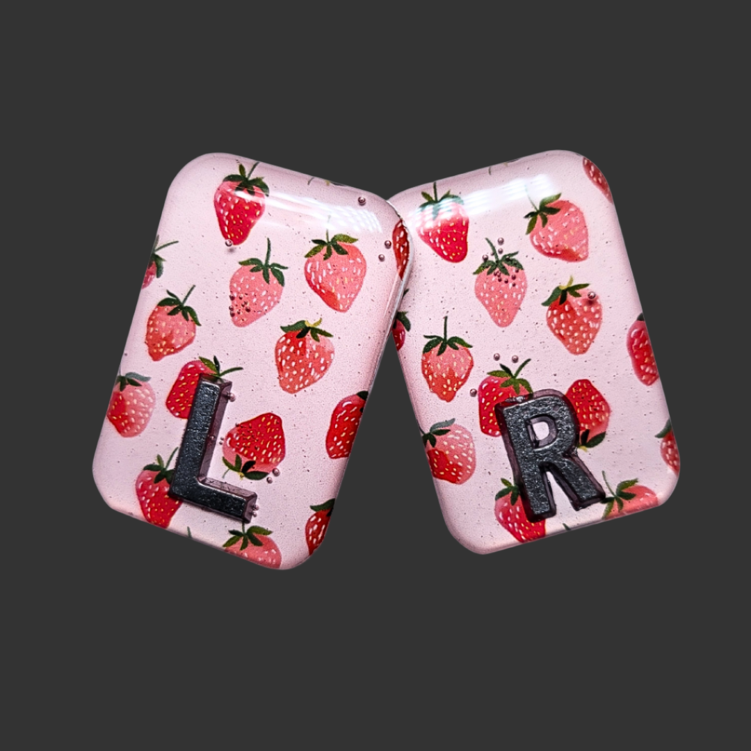 Strawberry-themed X-ray markers in red and green, fun and functional for radiographers and X-ray techs.