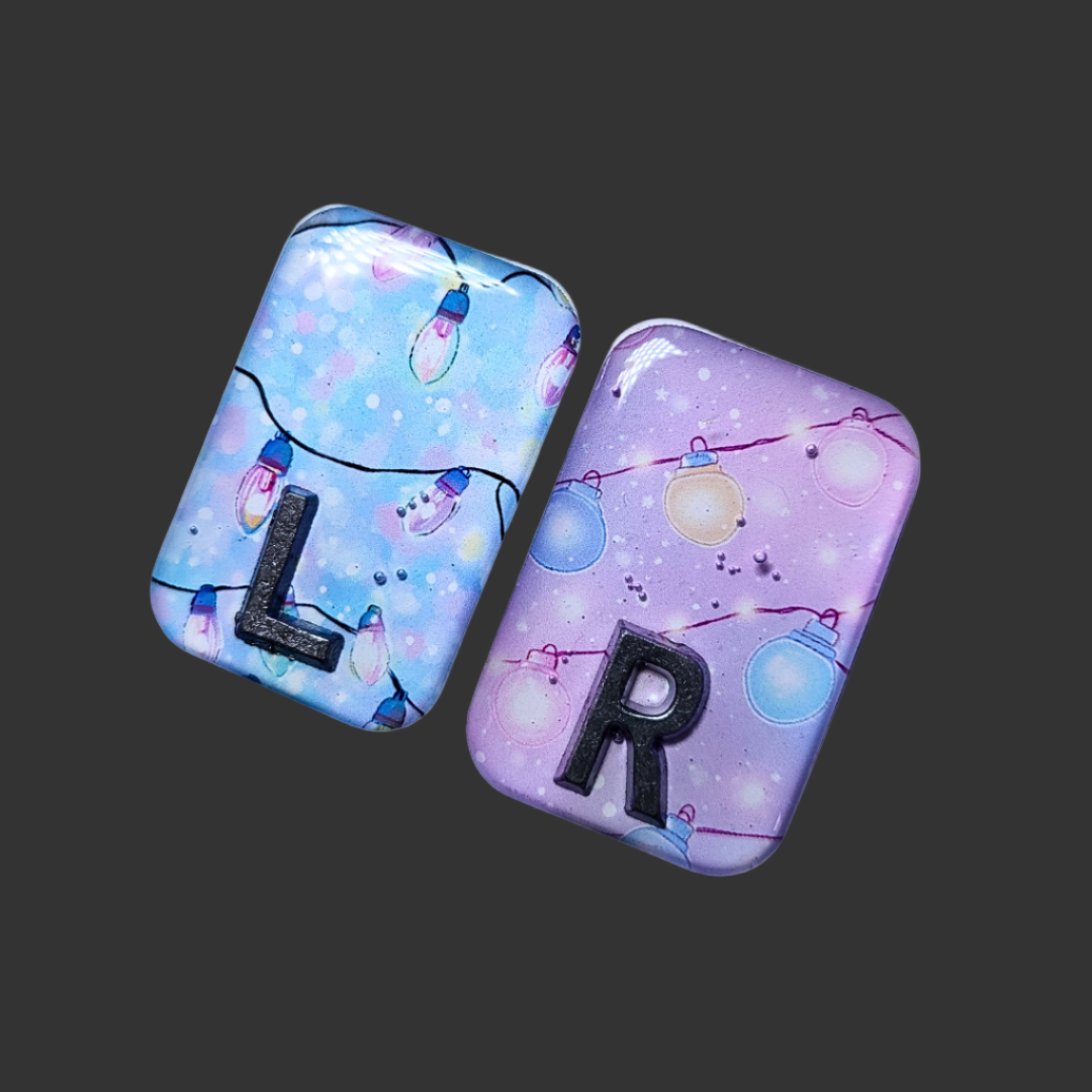 "Blue and pink fairy light X-ray markers customized with initials or numbers.