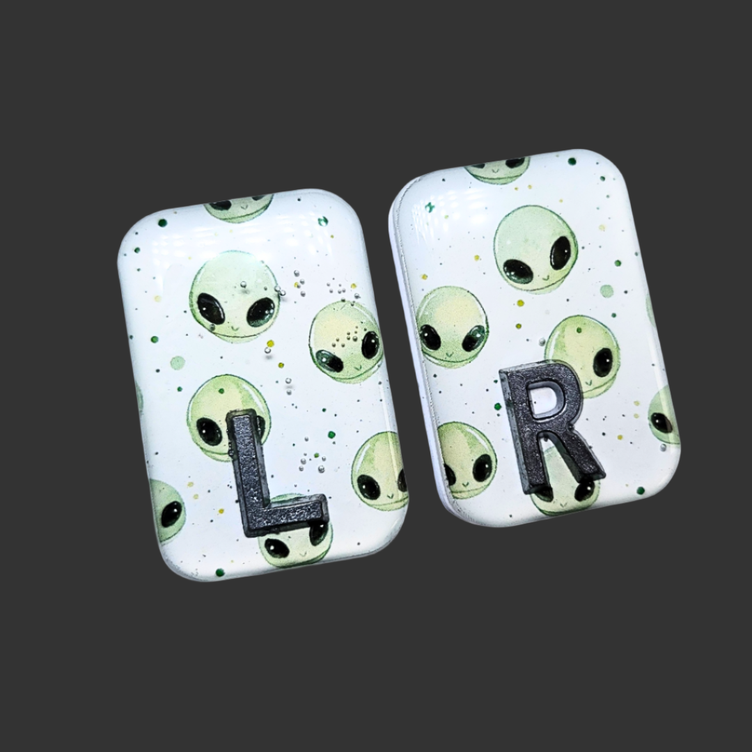 Handmade alien X-ray markers for radiographers, customisable with initials or numbers