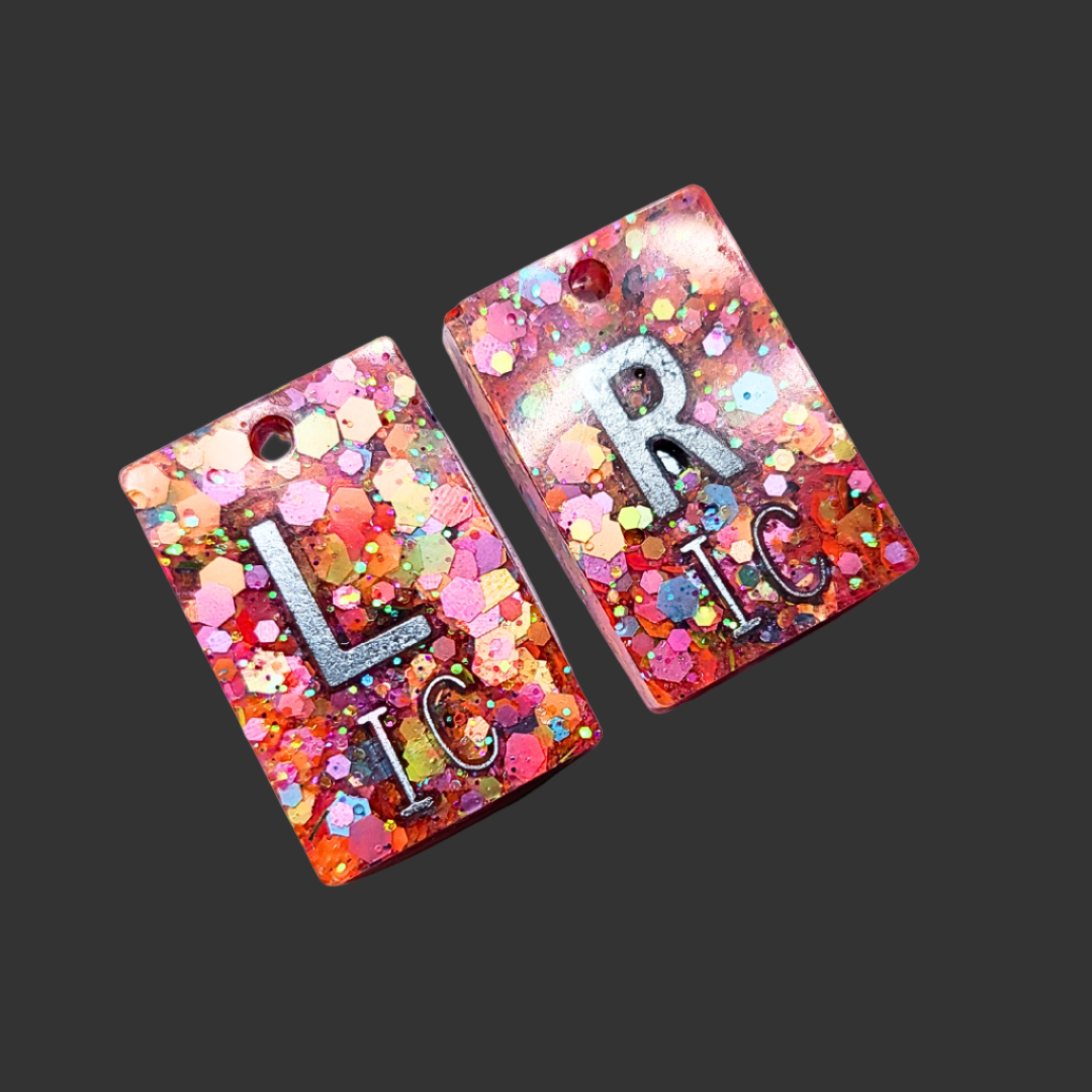 Orange polka glitter X-ray marker set with chain and personalisable initials or numbers.
