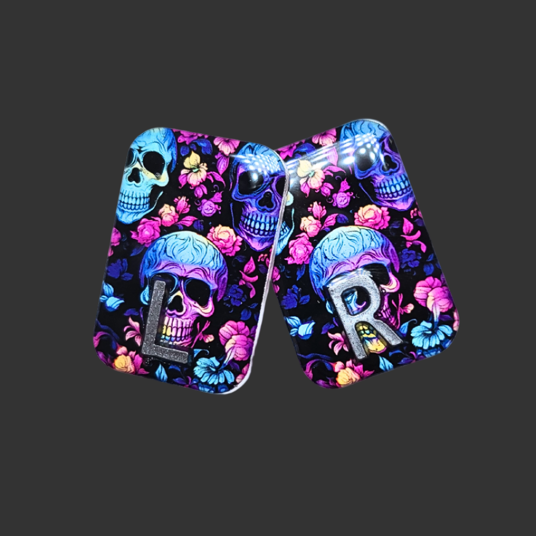 Handmade skull X-ray markers in bright black, pink, purple, and teal colours for radiographers.