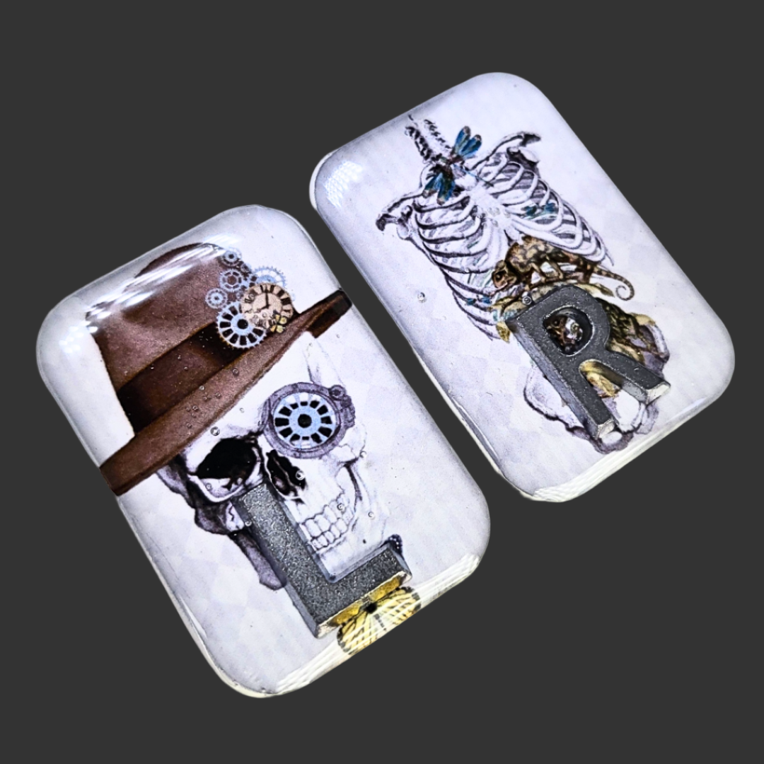 Handmade X-ray markers featuring a skull with hat left marker and thorax/pelvis anatomy right marker, personalised with initials
