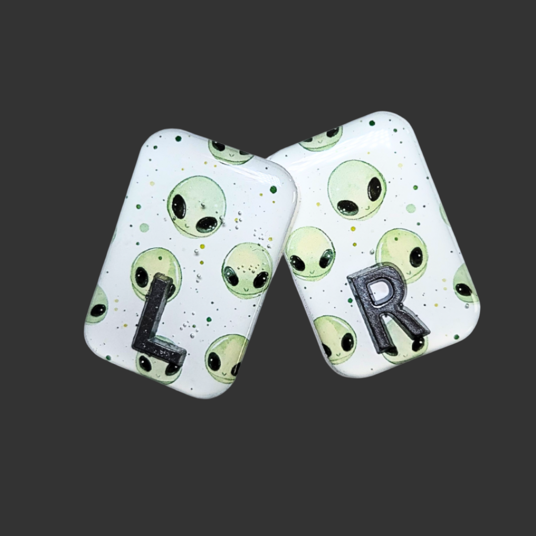 Handmade alien X-ray markers for radiographers, customisable with initials or numbers