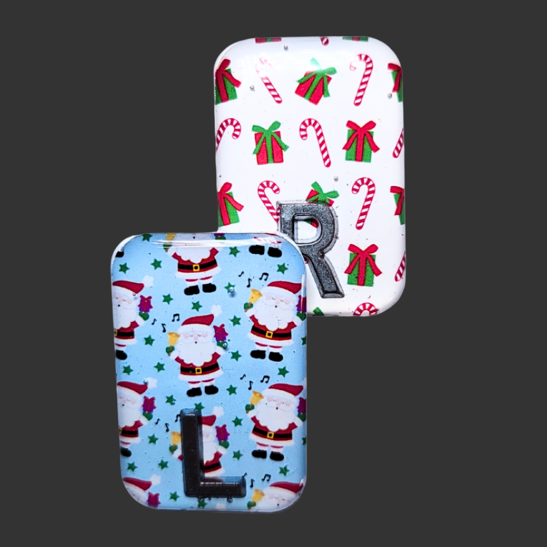 Blue Santa-themed X-ray marker and white candy cane X-ray marker with custom initials