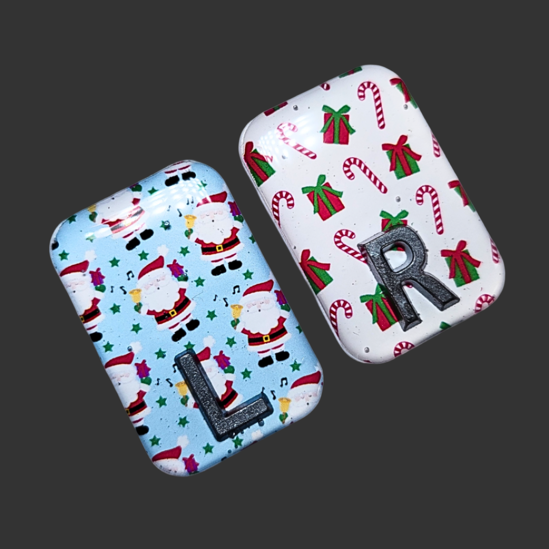 Blue Santa-themed X-ray marker and white candy cane X-ray marker with custom initials