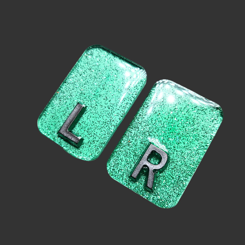 Set of green see-through markers with silver glitter inside for radiographers and x ray techs
