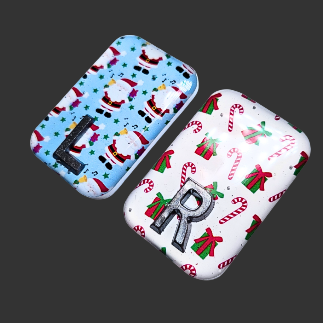 Blue Santa-themed X-ray marker and white candy cane X-ray marker with custom initials
