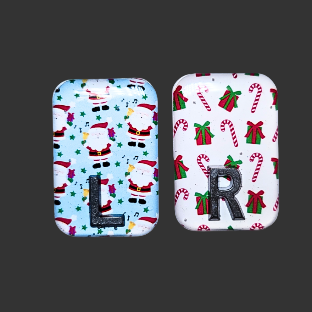 Blue Santa-themed X-ray marker and white candy cane X-ray marker with custom initials
