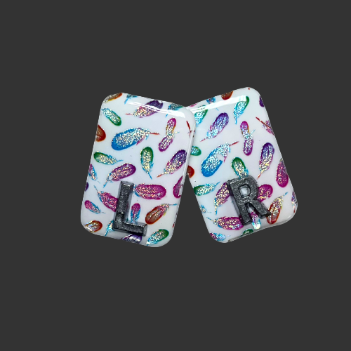 x ray markers with reflective holographic feathers, made by x ray vision uk for radiographers and x ray techs