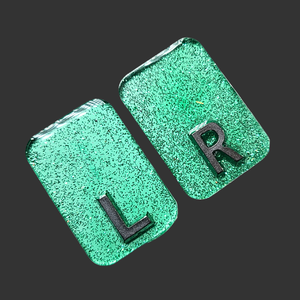 Set of green see-through markers with silver glitter inside for radiographers and x ray techs